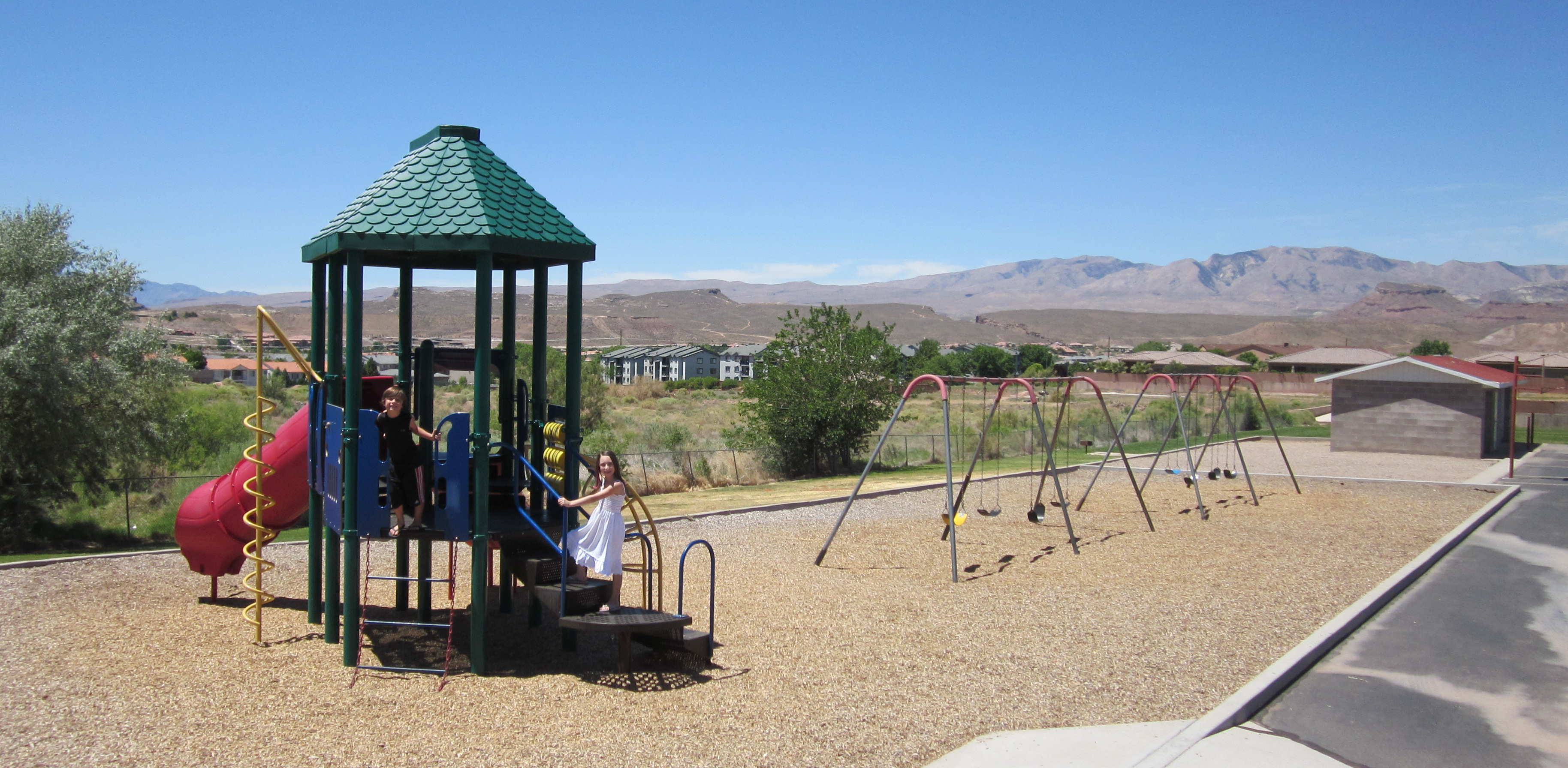 Play set, swings, and maintenance shed at Sunset Elementary School