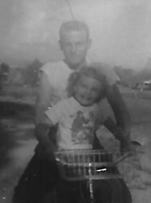 Clark and little sister, Beverly, on a bicycle in 1958